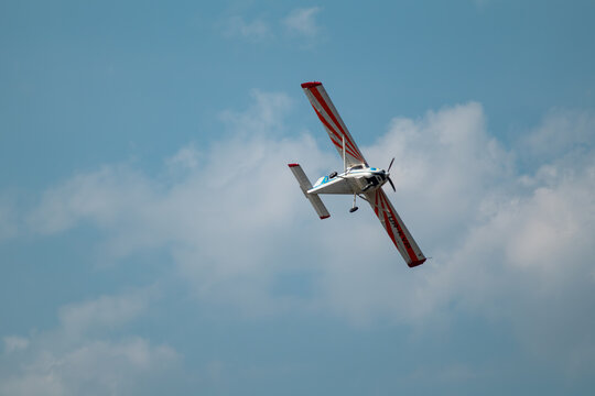 Kharkiv, Ukraine - August 29, 2021: aerobatic flight of  ViS-3 ultralight plane in scenic sky at airshow