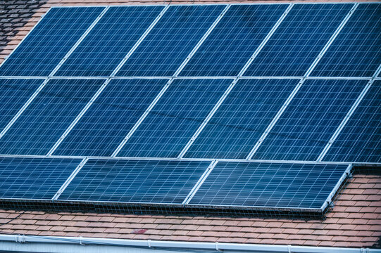 Residential houses with rooftop solar panels, renewable energy for sustainable homes