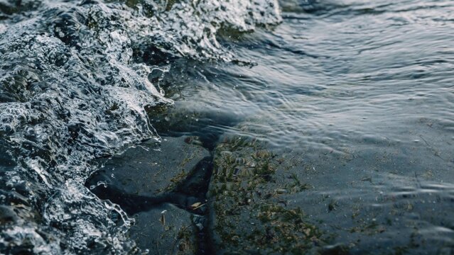 Dynamic Ocean Waves Crashing Over Coastal Rocks