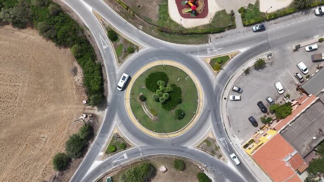 Aerial Drone View of Scenic Sardinia Road Through Mediterranean Landscape, Italy
