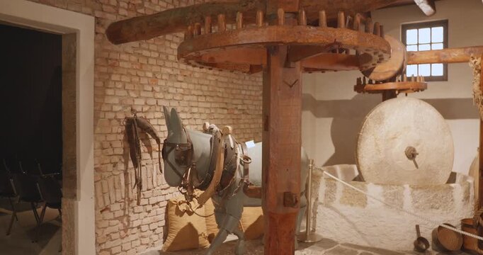 Model Of A Traditional Donkey-Powered Olive Mill Inside The Museo Dell Olivo Carlo Carli In Imperia, Italy. - wide shot