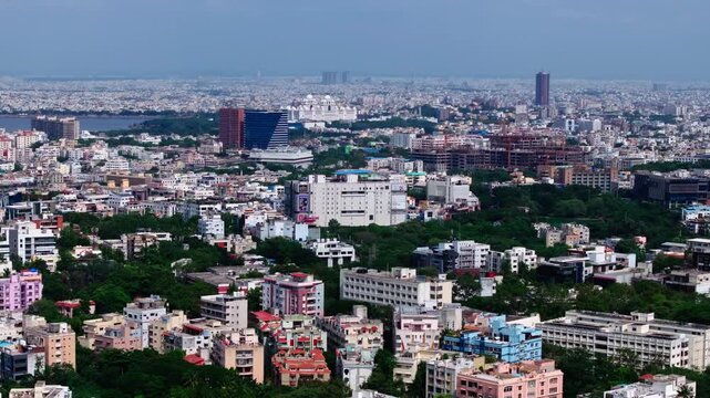 Wide view of cityscape with Secretariat, skylines, residential buildings and NIMS New Extended Building at hyderabad, telangana, india. day time, push in shot, drone shot, 4k.