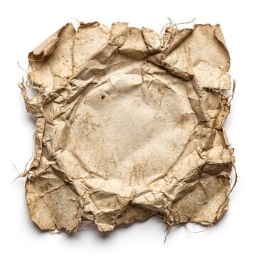 A crumpled piece of aged, torn parchment paper with frayed edges lies isolated on a white background.
