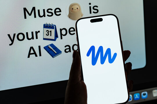 In this photo illustration, a person holds a smartphone displaying the logo of Muse, Meta&rsquo;s personal AI agent.