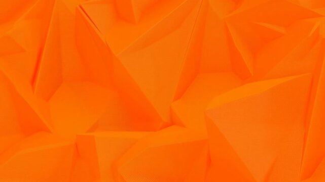 Bright orange geometric planes subtly shift across an abstract digital surface. Advertising design, branding, and social media graphics.