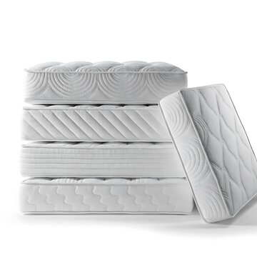Stack of new comfortable white mattresses on a studio white background