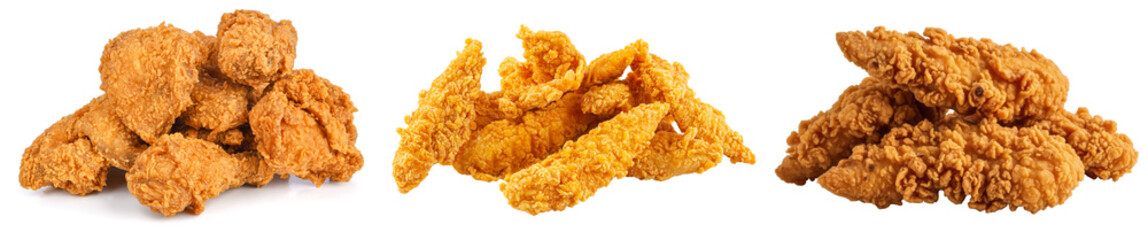 Three piles of crispy fried chicken pieces and tenders isolated on a white background © NamCam
