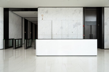 Modern minimalist office building reception desk area with marble walls