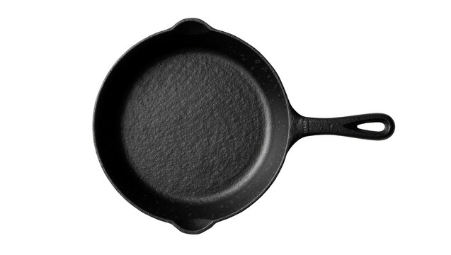 Heavy black cast iron skillet with textured surface, isolated on transparent background