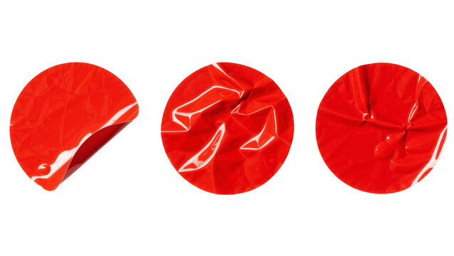 Three crumpled red circular stickers with peeling edges, isolated on transparent background