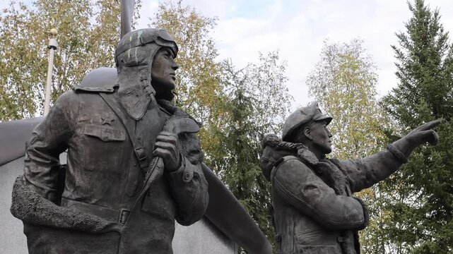 View of the bronze Lend-Lease Monument depicting pilots in flight gear in Fairbanks, Alaska, United States.