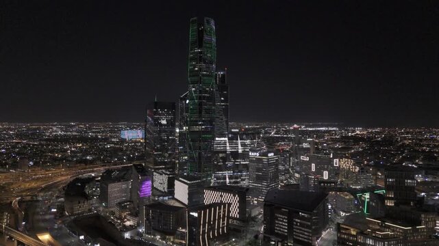 Aerial Pullback View of King Abdullah Financial District at Night in Riyadh
