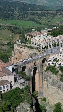 Ronda aerial vertical view - the famous Puente Nuevo Bridge over the El Tajo gorge, a historic town on the edge of a rocky gorge