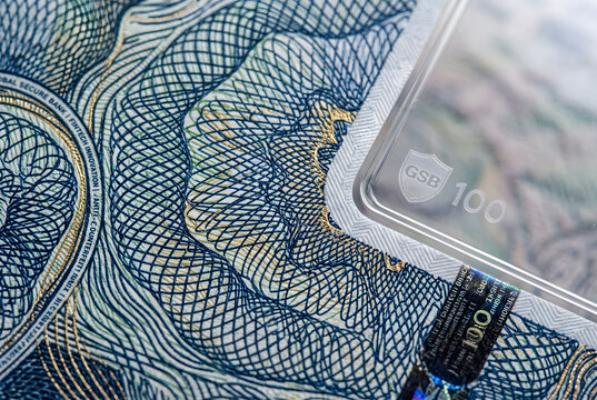 Close-up of Microscopic Security Guilloche Pattern Engraved on Polymer Currency Note