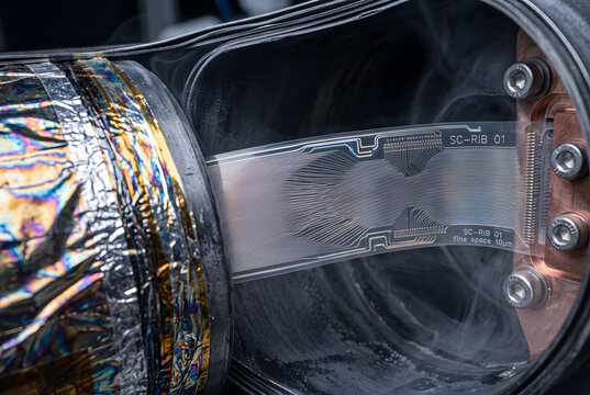 Macro Shot of Twisted Superconducting Ribbon Cable in Quantum Shielding Enclosure