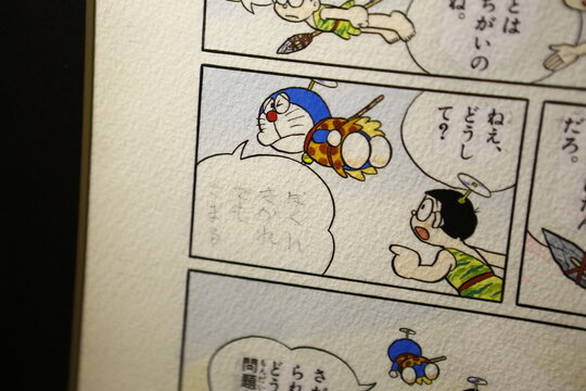 A close up of original manga artwork featuring Doraemon characters.