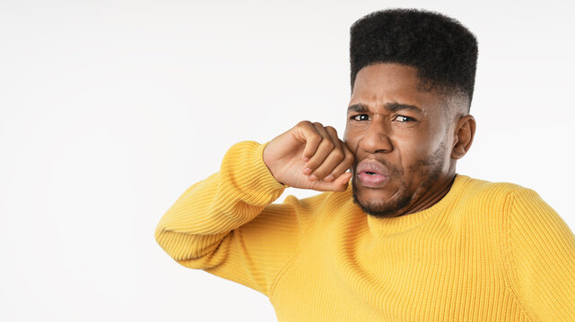 Close up of young man with disgusted expression repulsing something isolated over white background, displeased male showing aversion, rejection, discomfort, dislike and negative reaction concept