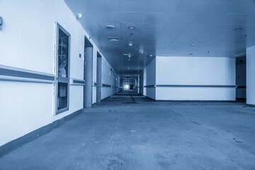 Ethereal Blue Tones in an Abandoned Hospital Corridor © evening_tao