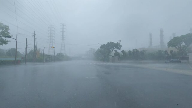 Powerful Hurricane Winds Drive Sheets Of Rain Across Highway