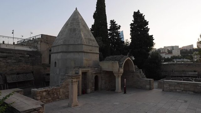View of the historic Seyid Yahya Bakuvi Mausoleum featuring its stone dome and arched entrance within the Old City of Baku, Baku, Baku, Azerbaijan.