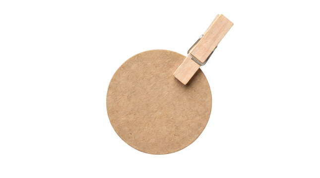 Rustic wooden clothespin on round kraft paper tag. Natural brown cardboard circle with peg. Minimalist craft stationery mockup. isolated PNG with Transparent Background