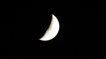 The half moon in the dark night sky. Close-up. © Viktor