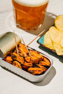 beer, mussels and potato chips appetizer