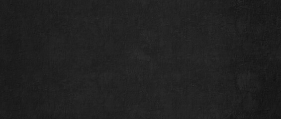 Fototapeta premium Premium black concrete texture background. Dark charcoal panoramic stucco plaster wall with subtle rough texture