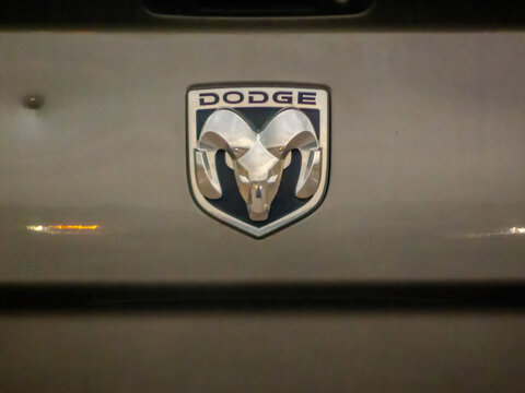 CALGARY, AB, CANADA - SEP 09, 2026: Straight on close up view of the silver Dodge Ram logo emblem on the back tailgate of a pickup truck.