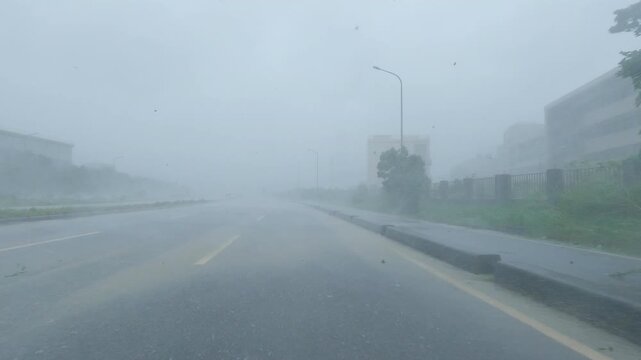Car Drives Through Blinding Rain As Hurricane Lashes City