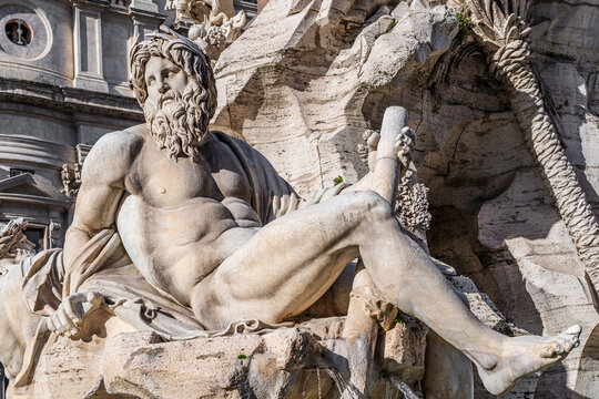River Ganges statue part of the Four Rivers Fountain from 1651 by Gian Lorenzo Bernini in baroque style located in the center of Navona Square in Rome, Lazio reigon, Italy