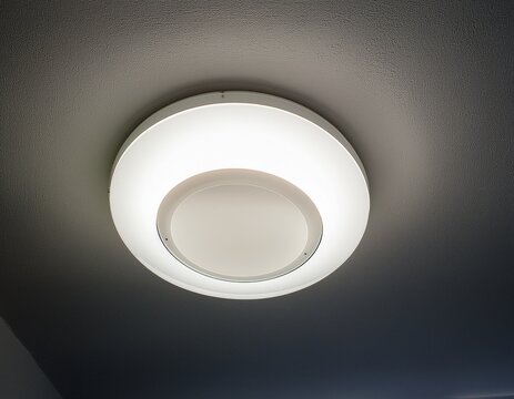 round shaped white led lamp installed in the ceiling providing bright and modern interior lighting design