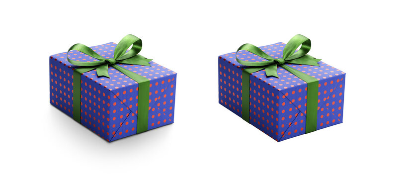 Two blue gift wrapped presents with red metallic spots and green ribbon bows, one with a shadow, one without isolated against a transparent background.