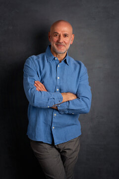 Smiling caucasian man against dark background