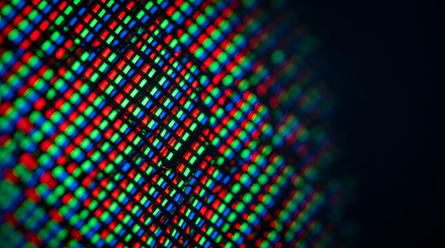 Pixelated Palette: A macro view of a digital screen displaying a grid of vibrant red, green, and blue sub-pixels, hinting at the intricate technology behind digital imagery and display.