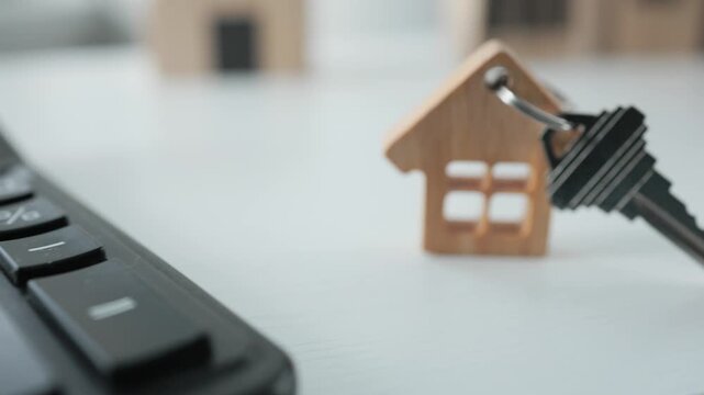 Calculator and House Keychain with Keys Close Up