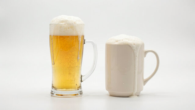 Cold lager beer in glass mug and ceramic stein, golden pilsner with thick white foam head, refreshing alcoholic beverages on white background