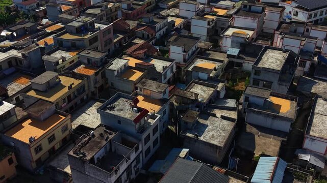 Close-up aerial view of dried corn kernels on a village rooftop during harvest season