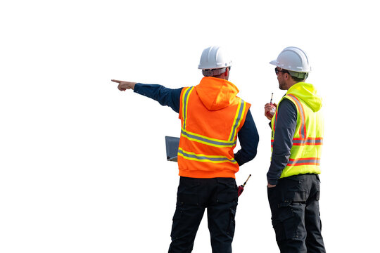 Engineers wearing safety gear, including hard hats examining survey standing industrial facility engaged in a job requires high safety standards concept with PNG white background.