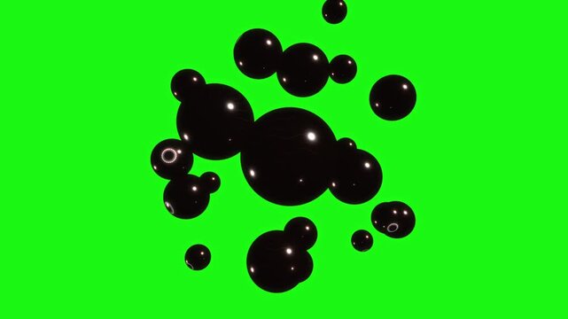Glossy dark eyeball spheres hover and cluster together against a solid green screen backdrop for visual effects compositing