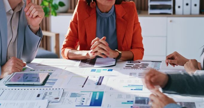 Business people, hands or meeting with documents for statistics, analytics or performance review. Group, employees or collaboration with paperwork, graph or chart for ideas or analysis in workplace