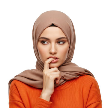 Thoughtful woman in orange top with headscarf