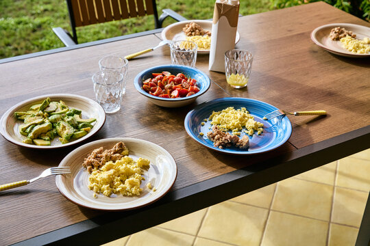 Healthy Breakfast Served on an Outdoor Patio Wooden Table