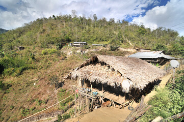 View of the Raga village of the Miri tribe or Mising in the Indian Arunchal Pradesh state © robnaw