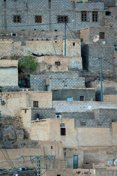 Close view of mudbrick houses on a hillside, North Africa, Djanet, Algeria