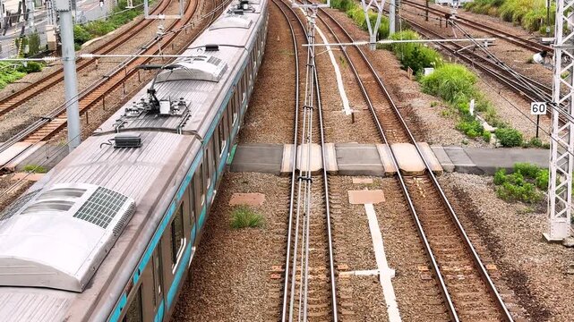 Keihin-Tohoku Line train resuming operation after an emergency stop in Japan