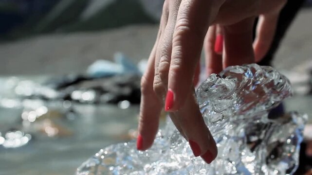Woman Touching Glacial Ice At Laguna Torre In El Chalten Argentina 