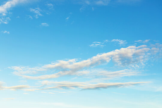bright sky with traces of clouds on blue atmospheric background