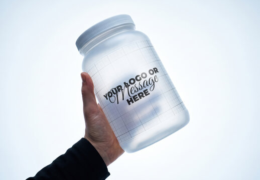 Hand Holding Translucent Supplement Container Mockup