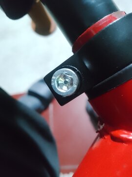Close up photo of L bolt at push bike steering rod